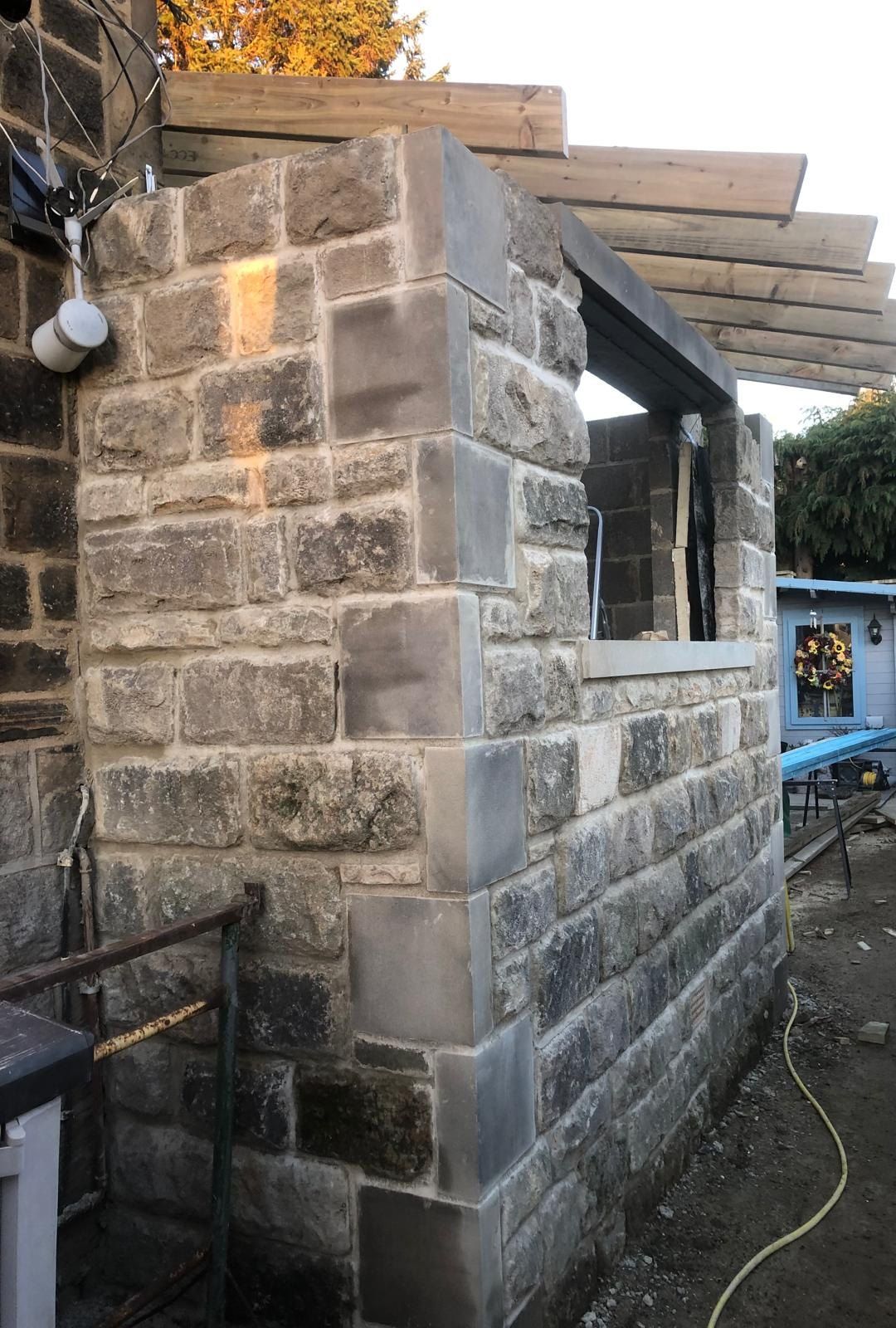 A stone-faced extension going up