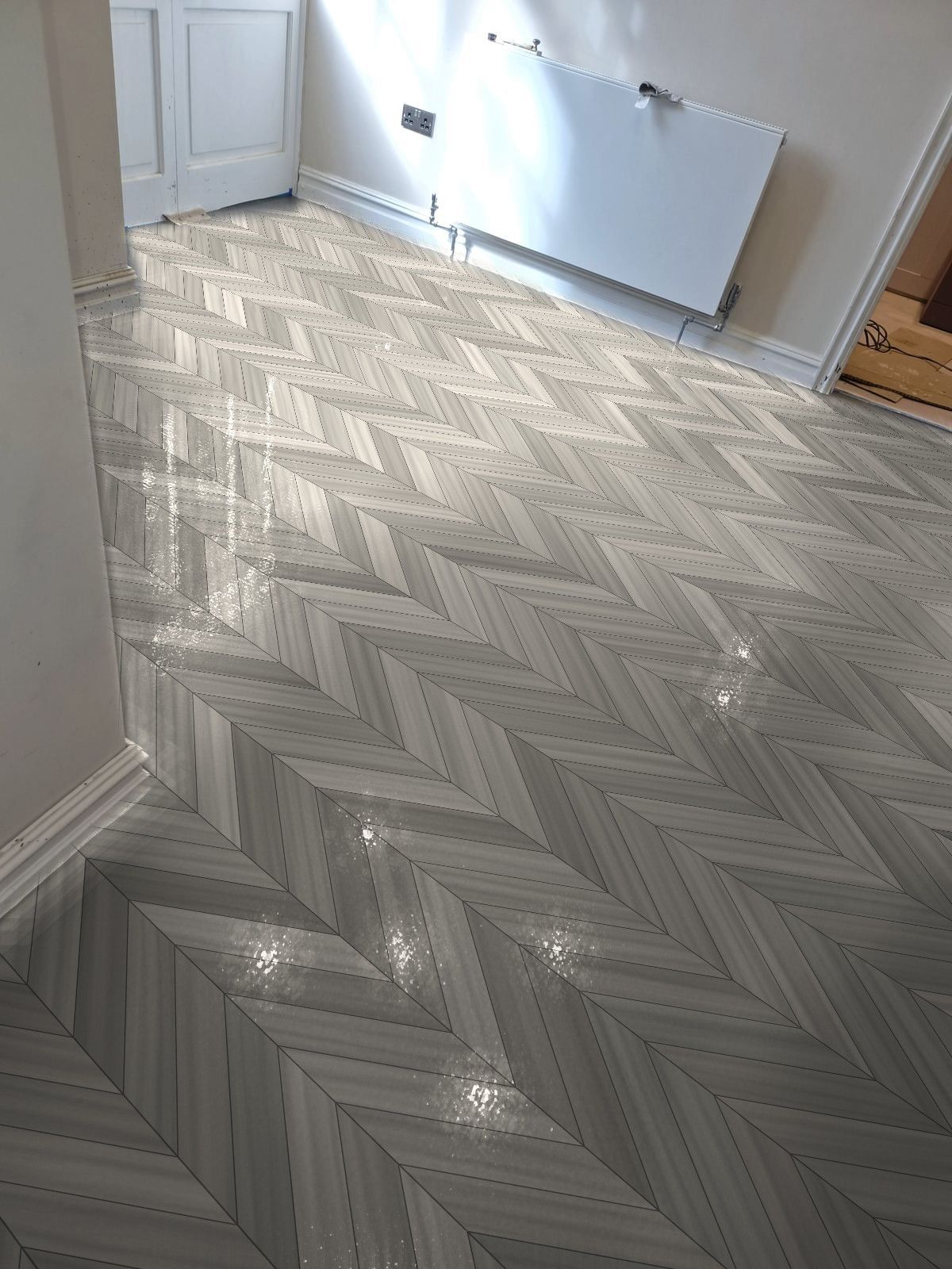 The same hallway with grey chevron LVT, shown in the visualiser