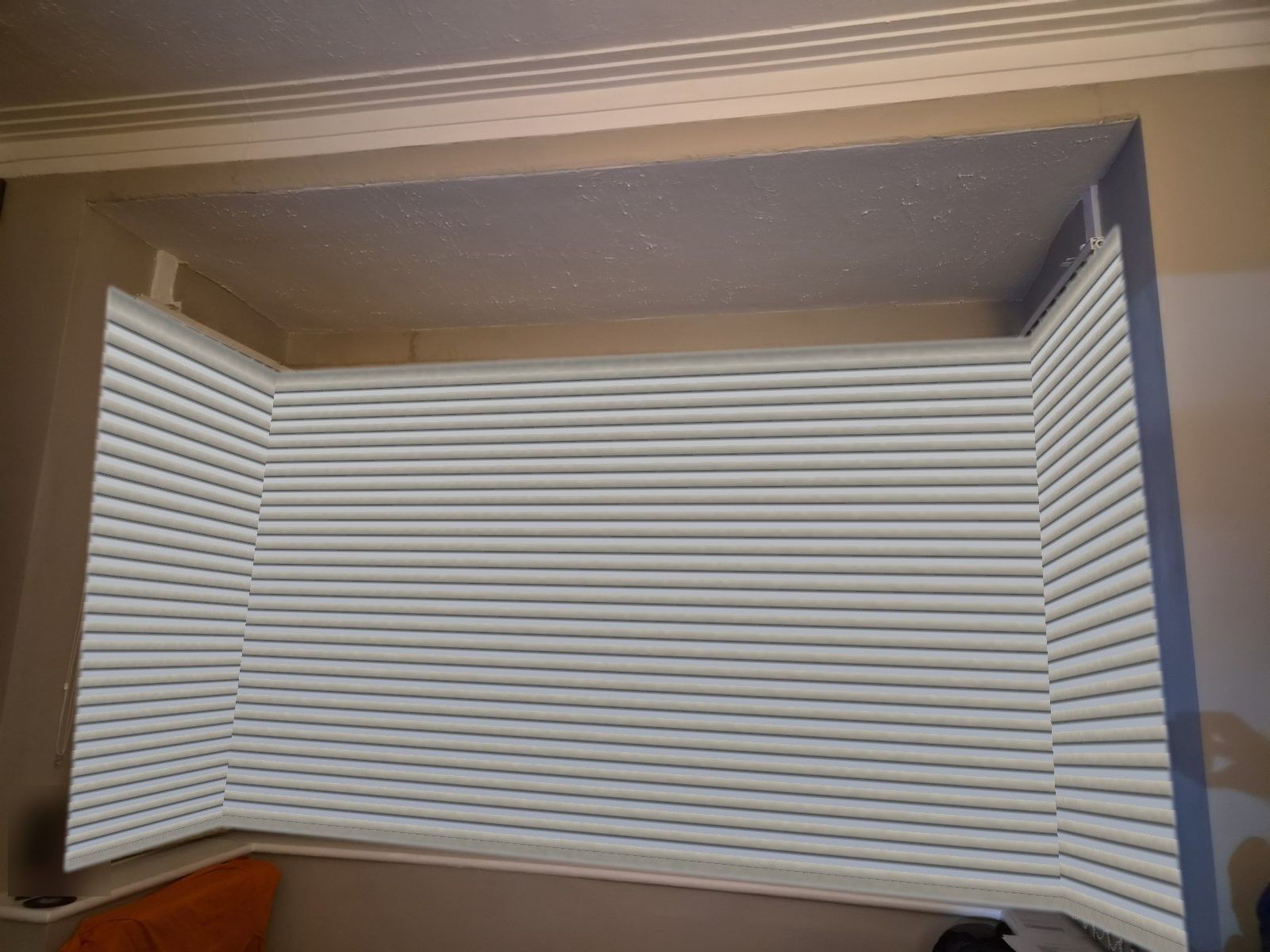 White Venetian blinds in a bay