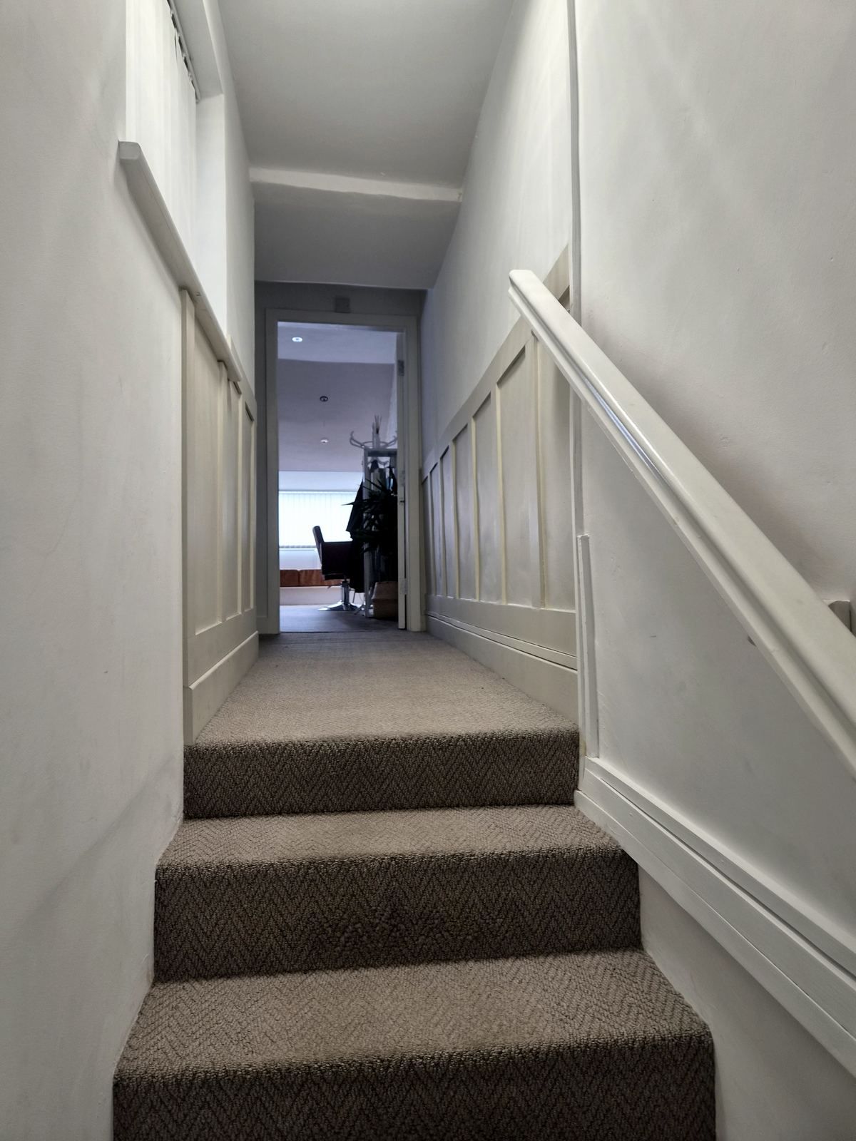 Panelling carried up a staircase